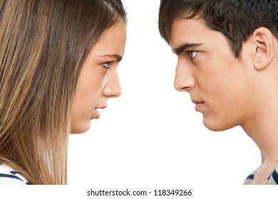 Close up portrait of teen couple with angry face expression.Isolated.