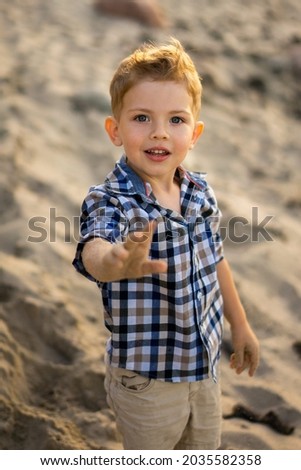 Similar – Foto Bild Kind spielt mit Sand auf den Dünen