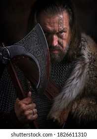 Close Up Portrait Of Viking With Axe