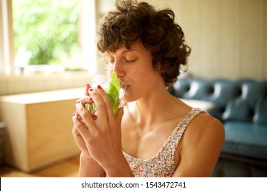 Close Up Portrait Of Woman Drinking Mint Tea At Home