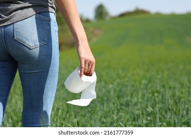 Close Up Portrait Of A Woman Hand Holding Toilet Paper In The Mountain