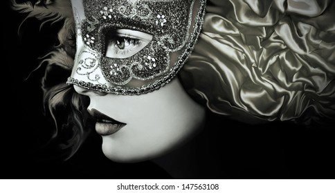 Close Up Portrait Of Woman In Mysterious Venetian Mask 