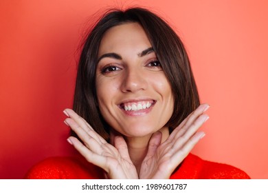 Close Portrait Of Woman On Red Background Looks To Camera Excited Cheerful With Huge Smile On Face