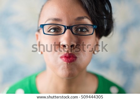 Close up portrait of woman puckering her lips