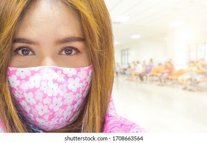 Close Up Portrait Of Woman Wearing Mask On Blur Hospital  Background. Prevention During Coronavirus Or Covid 19 Outbreak, Blur Of People Waitting Doctor In Lobby Hospital.