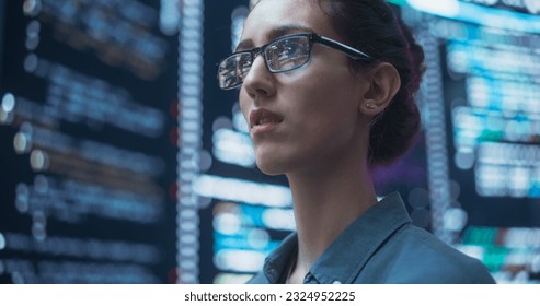 Close Up Portrait of Woman Working on Computer, Lines of Code Language Reflecting on her Glasses from Big Display Screens. Female Programmer Developing New Software, Coding, Managing Cybersecurity - Powered by Shutterstock - Get 15% off with code: PIKWIZARD15