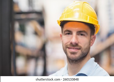 Close Up Portrait Of Worker Wearing Hard Hat In The Warehouse