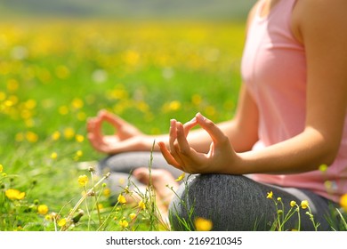 Close Up Portrait Of A Yogi Hands Exercising Yoga In A Green Field In Spring