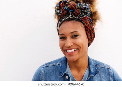 Close Up Portrait Of Young Afro American Female Smiling Against White Background