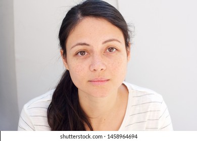 Close up portrait of young asian woman with sad expression - Powered by Shutterstock