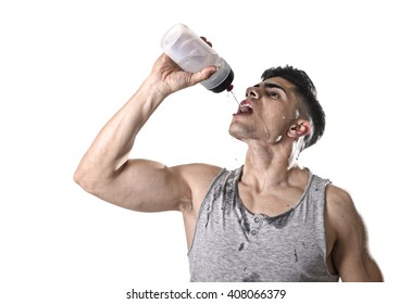 Close Up Portrait Of Young Athletic Sport Man Thirsty Drinking Water Holding The Bottle Pouring The Fluid On His Sweaty Face Refreshing And Recovering After Hard Training Workout In Hydration Concept