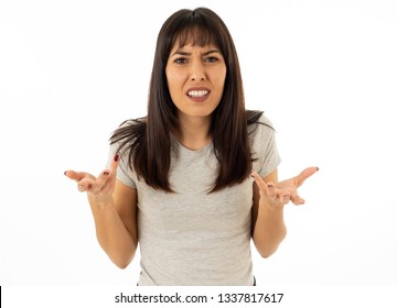 Close Up Portrait Of Young Attractive Caucasian Woman With An Angry Face. Looking Mad And Crazy Shouting And Making Furious Gestures. Isolated On White Background. Facial Expressions And Emotions.