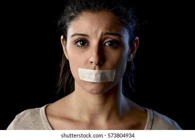 Close Up Portrait Of Young Attractive Woman With Mouth And Lips Sealed In Adhesive Tape Restrained And Abused Censored And Banned To Speak And Express Opinion In Freedom Concept