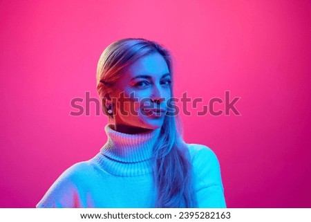Close up portrait of young beautiful woman with smirk, suspicious looking at camera against gradient pink background. Concept of human emotions, facial expression, energy, ideas, shopping. Ad