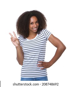 Close up portrait of a young black woman showing two fingers peace sign