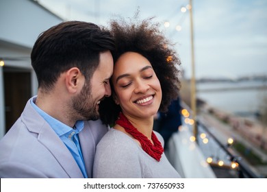 Close up portrait of young couple embracing. - Shutterstock ID 737650933
