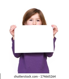 Close Up Portrait Of A Young Girl Holding Blank Sign