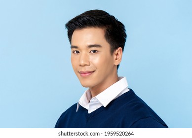 Close Up Portrait Of Young Handsome Asian Man Face On Light Blue Studio Background