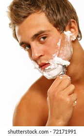 Close Up Portrait Of Young Handsome Man Face With Perfect Skin Shaving With Foam.