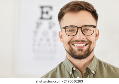 Close up portrait of young happy smiling male optician doctor wearing eyeglasses working in medical clinic and looking cheerful at camera. Ophthalmology, vision and eye health concept. - Powered by Shutterstock