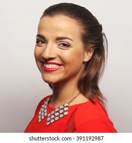 close up portrait young happy woman in red dress - Shutterstock ID 391192987