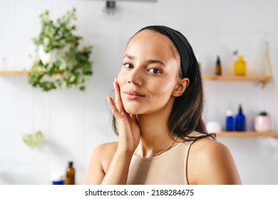 Close Up Portrait Of Young Hispanic Woman Touching Face With Fingers. Wellness, Cosmetics, Skin Care