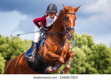 Close up portrait of young jockey girl leaping over obstacle on show jumping competition. - Powered by Shutterstock