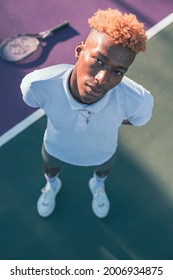 Close Up Portrait Of Young Man On Tennis Court