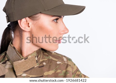 Close up portrait of young military girl look focused empty space isolated on white color background
