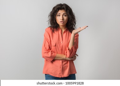 Close Up Portrait Of Young Pretty Woman, Mixed Race, Curly Hair, Suprised, Shocked Emotion On Face, Looking In Camera, Isolated, Orange Blouse