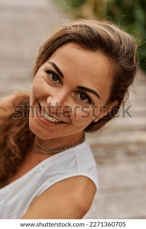 Similar – Portrait of a beautiful young woman outdoor smiling