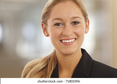 Close Up Portrait Of Young Woman In Business Suit