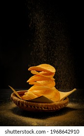 Close Up Of Potato Chips With Black Pepper, Salt With Cheese Powder Spray On Top Isolated Concept On Black Background With Reflect Shadow At Bottom