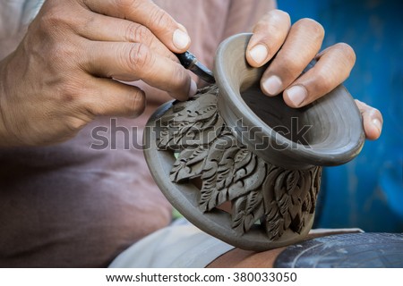close up potter artist working on clay pottery sculpture fine art in thailand 