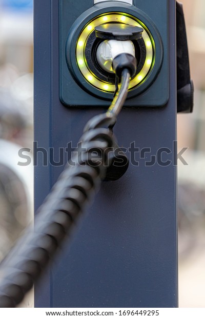 Close Up power supply connect to electric vehicle\
for charging battery