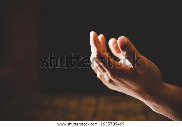 Close up prayer\
hand pray in church, Pastor pray to God, with blank copy space,\
Spirituality and Religion\
Concept