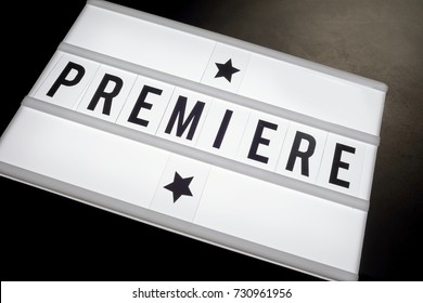 A Close Up Of Premiere Written On Word Board With Stars In A Cinema Movie Theme.