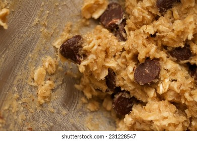 Close Up Preparation Of An Abstract Texture Background For Homemade Chocolate Chip Oatmeal Cookie Dough Batter Inside A Baking Mixer. These Cookies Are Sweet Desserts For Snacks 