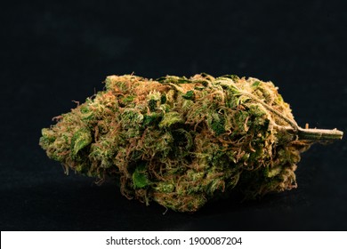 Close up prescription medical marijuana flower. CBD cannabis bud photography for dispensary menu. Medical marijuana strain. Weed bud, weed flower on black background.