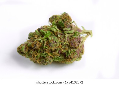 Close up of prescription medical marijuana and recreational weed hybrid OG strain sticky flower bud isolated on a white background
