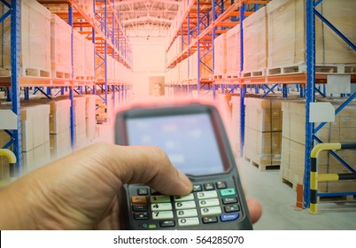 Close up press a button scanner barcode to inventory warehouse.