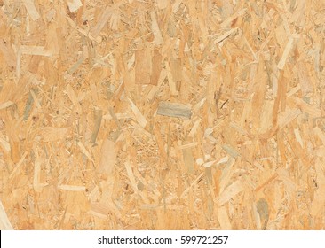 close up pressed wooden panel background, seamless texture of oriented strand board - OSB wood - Shutterstock ID 599721257