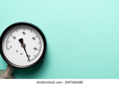 close up of pressure gauge on green table background, engineering equipment concept - Shutterstock ID 2047683680