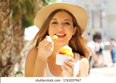 Close Up Of Pretty Tourist Girl Eating Traditional Gelato Italian Ice Cream In Sirmione, Italy