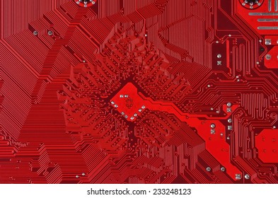 Close up of a printed red computer circuit board