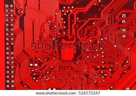 Close up of a printed red computer circuit board