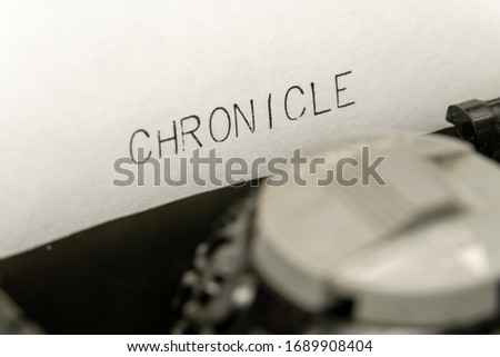 Close up printed text Chronicle on an old typewriter
