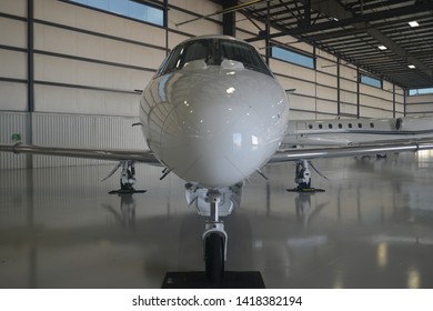 Close Up Of Private Jet In Hanger