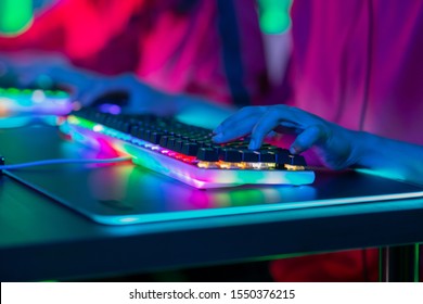 close up of pro cyber sport gamer play game with RGB keyboard 
