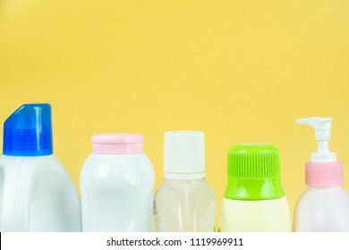 Close Up Products Made Of Plastic In Everyday Life. It Is Widely Used. On Yellow Background.